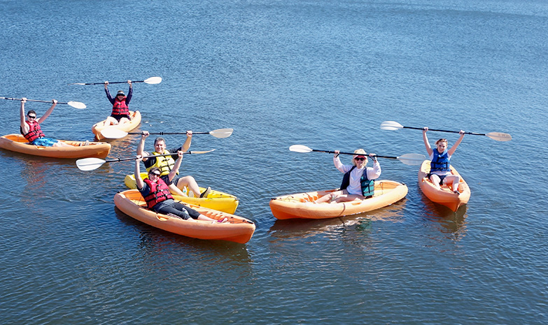 Group kayaking on river